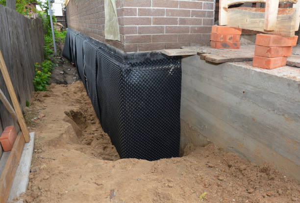 Happy homeowners after waterproofing job in Grand Haven